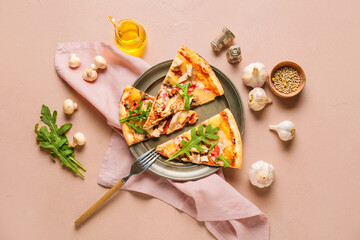 Plate with slices of tasty pizza on color background