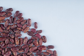 Many grains of dried beans on a white background