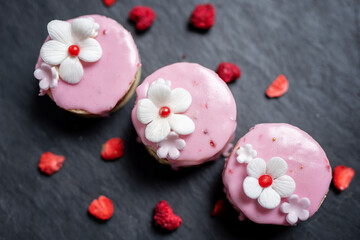 selection of cute pink love sponge cakes  for mothersday valentines day wedding with freezedried berries
