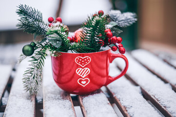 christmas decoration in the cup of love on the table