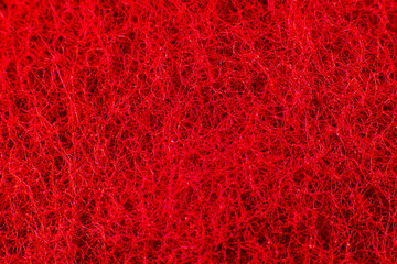 Red sponge texture background. Close up, macro photo.