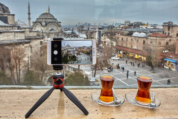 Holder for your mobile phone is attached to tripod for filming video clip about trip to Turkey and...