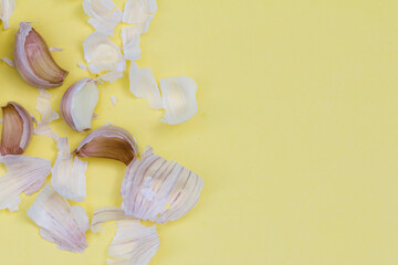 garlic on yellow background, alternative medicine virus protection concept
