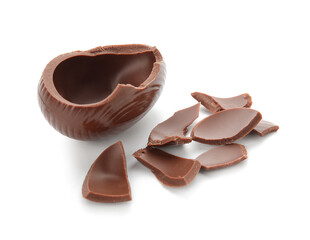 Broken chocolate Easter egg on white background