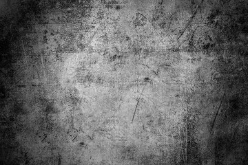 Close-up shot of concrete black and White texture background, grunge style, with vignette in the corner and there is a bright spot in the middle and in the middle is the copy space, top view.
