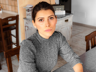 Portrait of a young brunette. Caucasian woman. Staying at home. Social isolation