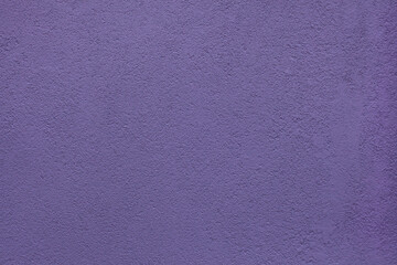 Purple painted stucco wall. Background texture.
