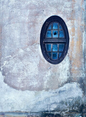 An old wall with  oval window