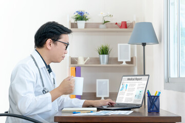 Fototapeta na wymiar Medical report with patient data and health care information in laptop. Doctor using digital smart device to read report online.