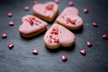 pink heart shaped short bread scotch butter cookies bisquits cakes for wedding, valentines, mothers day love dessert with freeye dried strawberries 