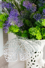 Beautiful decorative flowers in a vase for interior decoration, close-up.