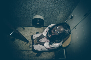Portrait of asian woman make up ghost face with blood,Horror scene,Scary background,Halloween...