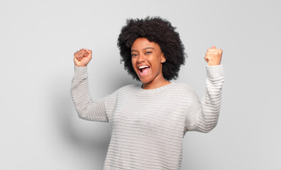  shouting triumphantly, looking like excited, happy and surprised winner, celebrating