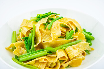 Chinese food, a dish of fried tofu skin with celery