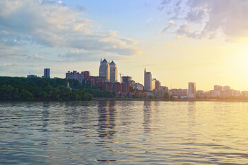 Obraz premium Panoramic view of Dnipro city viewed from Dnieper river. Dnipro city skyline at sunset.