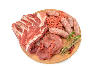 Raw meat products.Shish Kebab of pork ribs, steaks, fried sausages, minced meat, decorated with spices, on a round wooden cutting board.isolated on a white background.Flat layout.