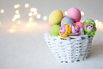 The basket is white with Easter eggs. Spring Easter holiday greeting.