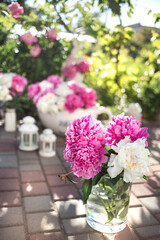 A bouquet of peonies on the background of a children's photo zone.