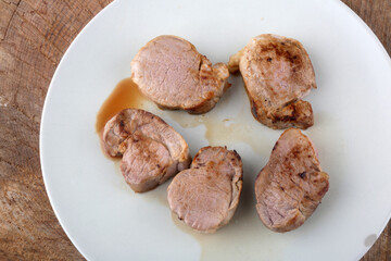 pork fillet meat cooked with sauce