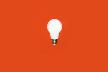 light bulb on an orange background. idea
