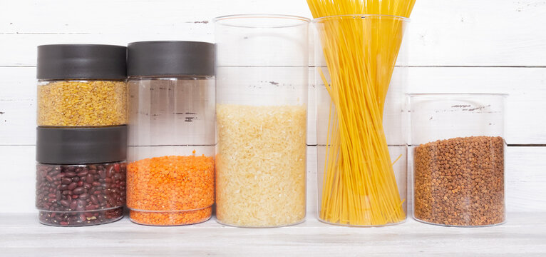 Zero-waste storeroom. Breakfast items, preserved in a resealable plastic jars, cereals, pasta. Banks can be filled several times with bulk products. Plastic.