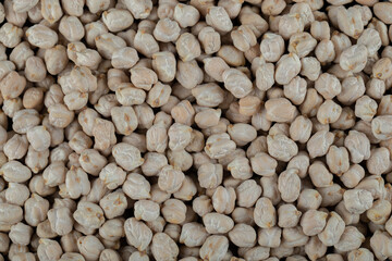 Some of white unprepared peas on a white background