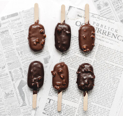 chocolate ice cream on newspaper