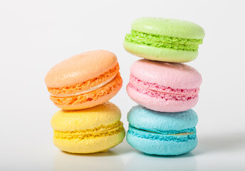 Colorful cake macaroons on a light background