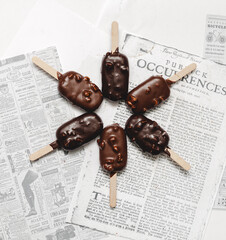 chocolate ice cream on newspaper