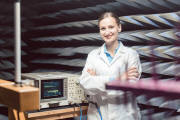 Engineer in electronics lab performing rf compliance test © Kzenon
