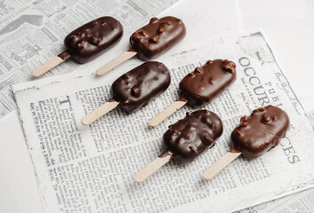 chocolate ice cream on newspaper