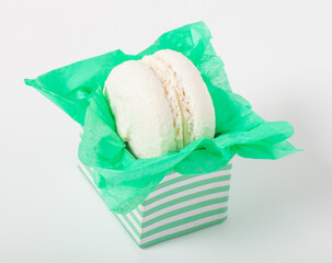Colorful cake macaroons on a light background