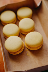 yellow macaroons lie on a crafting background