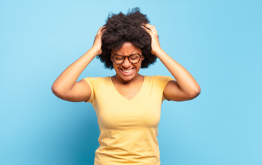  feeling stressed and frustrated, raising hands to head, feeling tired, unhappy and with migraine