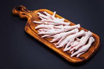 chicken paw on dark background