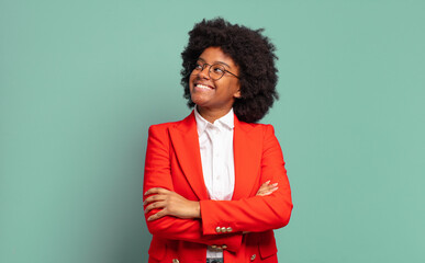  feeling happy, proud and hopeful, wondering or thinking, looking up to copy space with crossed arms