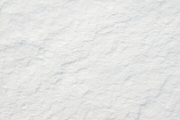 Fresh clean white snow background texture. Winter background with frozen snowflakes and snow mounds. Snow lumps. Seasonal landscape details. Cold weather.