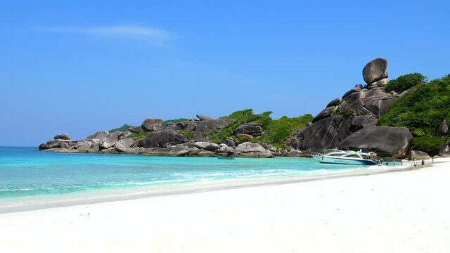 Travel Tour on Blue Ocean Beach with Big Rocks, Crystal Clear Turquoise Water and Greenery Near Tropical Island. Amazing Landscape with Azure Water and Blue Sky on Famous Similan Islands, Thailand
