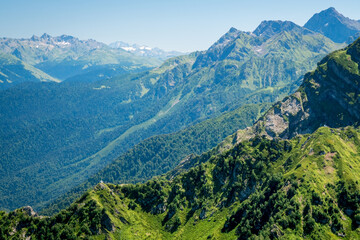Fototapeta premium Summer landscapes of the Caucasus mountains in Rosa Khutor, Russia, Sochi, Krasnaya Polyana. Peak 2320m