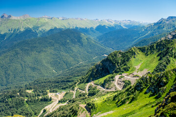 Naklejka na ściany i meble Summer landscapes of the Caucasus mountains in Rosa Khutor, Russia, Sochi, Krasnaya Polyana. Peak 2320m