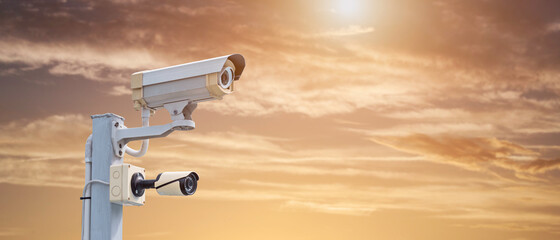 Modern CCTV security system on sky background Smart camera theft protection.