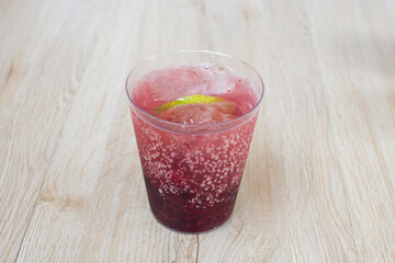 italian flavored sodas with ice and tropical flavors on white wooden background