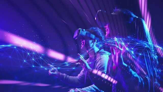 Teenager having fun play VR virtual reality glasses sport game 3D cyber space futuristic neon colorful background, future digital technology game and entertainment