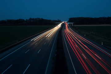 Night Autobahn, highway. Light lines from cars.