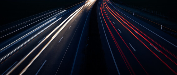 Fototapeta na wymiar Night Autobahn, highway. Light lines from cars.