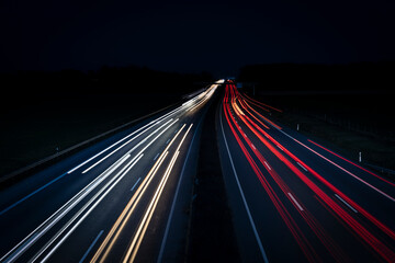 Fototapeta na wymiar Night Autobahn, highway. Light lines from cars.