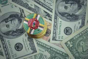 golden shining bitcoins with flag of dominica on a dollar money background.