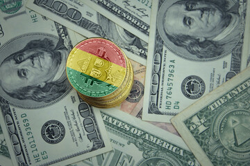golden shining bitcoins with flag of bolivia on a dollar money background.