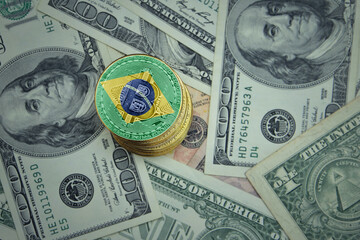 golden shining bitcoins with flag of brazil on a dollar money background.