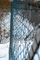 Wire mesh fence borders the property